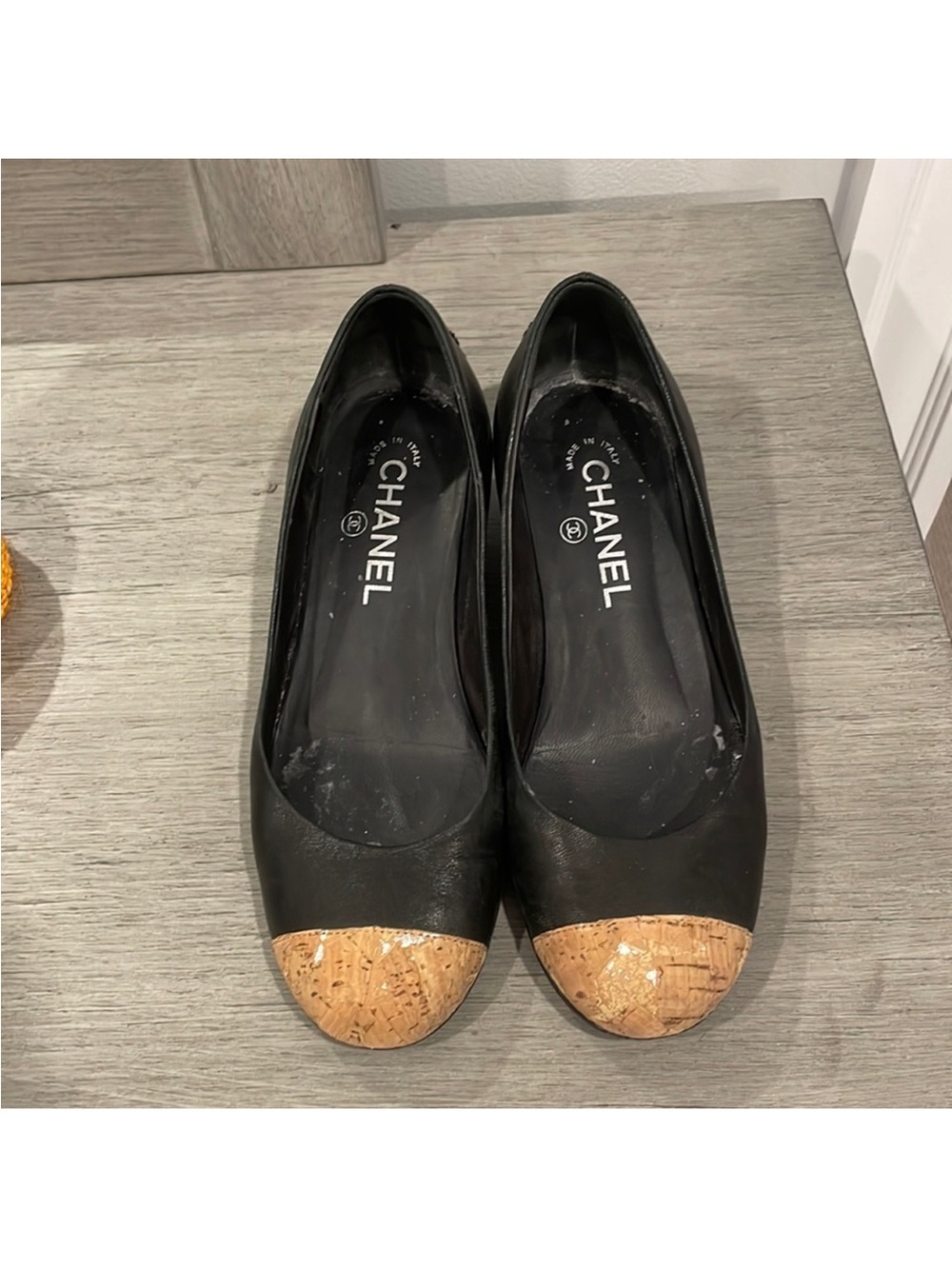 CHANEL Black Leather Ballet Flats with Cork Cap Toe